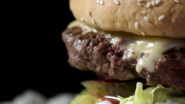 Hamburger on black background. - Footage, Video
