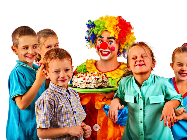 Birthday child clown playing with children. Kid holiday cakes celebratory. - Photo, Image
