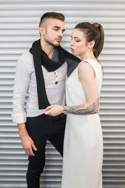 Fashion style photo of a beautiful couple - Фото, зображення