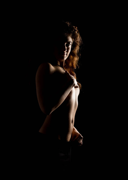 Elegant curves of female shoulders and neck, Redhead girl on a dark background - Zdjęcie, obraz