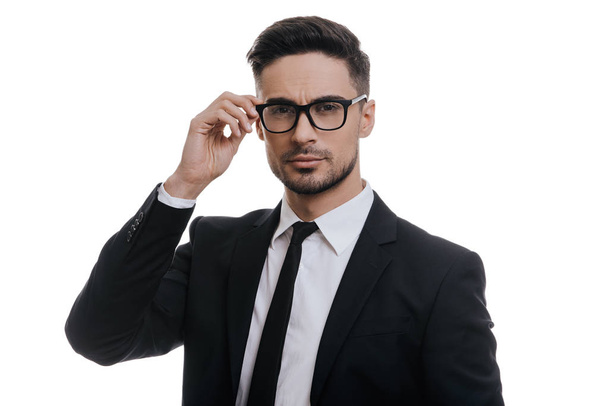 businessman adjusting eyeglasses - Fotografie, Obrázek