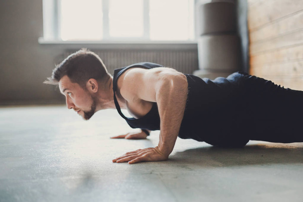 Young man fitness workout, push ups or plank - Zdjęcie, obraz