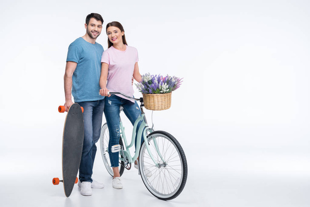 couple with skateboard and bicycle - Foto, Imagem