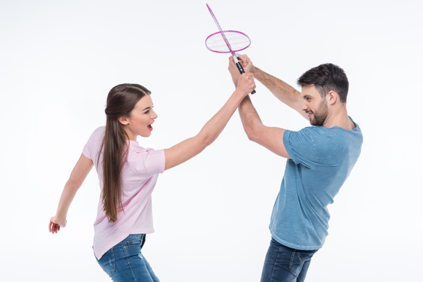 casal com raquetes de badminton
  - Foto, Imagem
