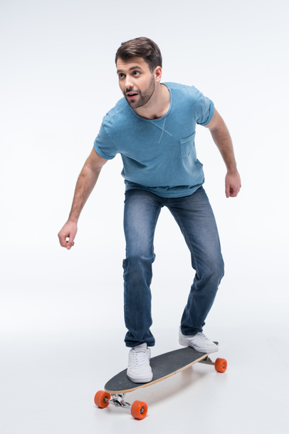 young man with skateboard - Фото, зображення