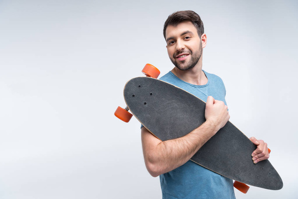 young man with skateboard - Zdjęcie, obraz