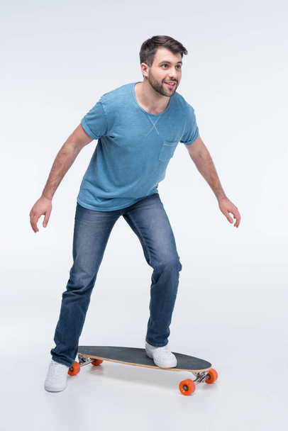 young man with skateboard - Фото, изображение