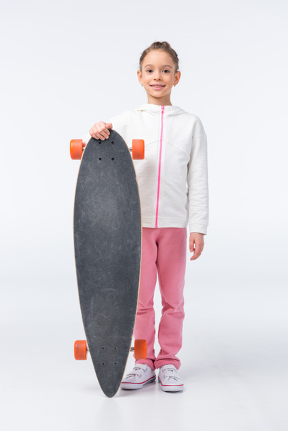 little girl with skateboard   - 写真・画像