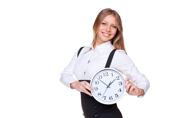 businesswoman holding the clock - Foto, afbeelding
