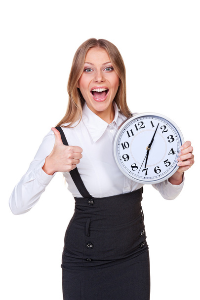joyful young businesswoman holding clock - Foto, Imagen