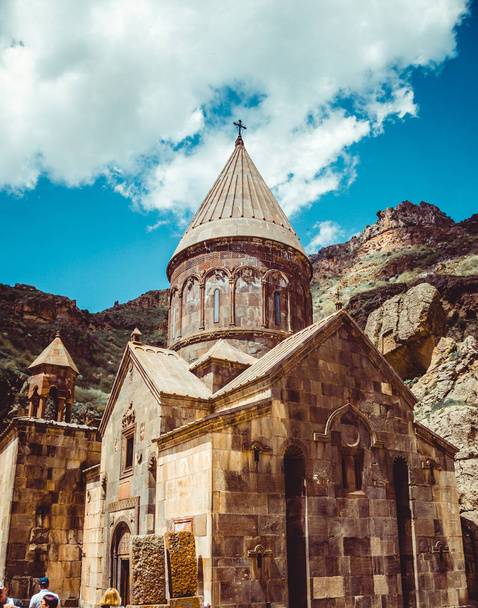 Geghardavank or Geghard monastic complex is Orthodox Christian monastery located in Kotayk Province, Armenia. Armenian architecture. Pilgrimage place. Religion background. Travel concept. Vertical - Photo, Image