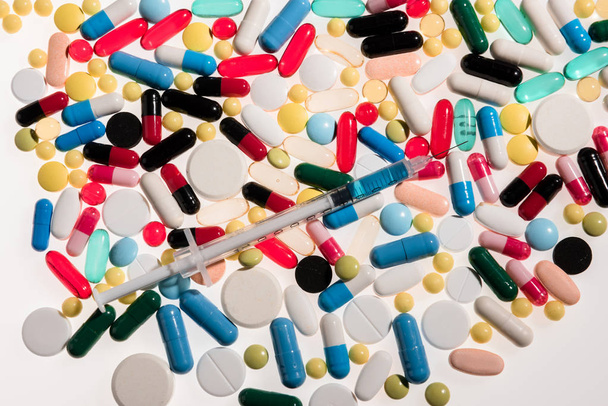 Medical pills and syringe  - Photo, Image