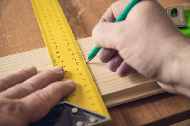 Measuring the wooden board - Photo, image
