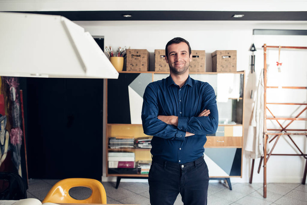 Confident businessman standing in studio - Photo, Image