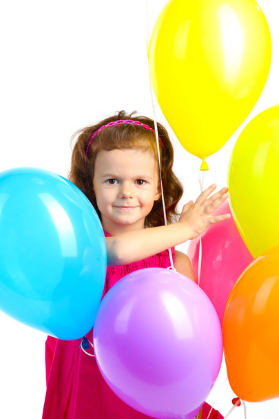 beautiful little girl with balloons isolated on white - Fotó, kép