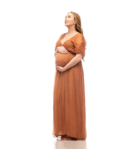 happy pregnant woman touching her big belly - Fotoğraf, Görsel
