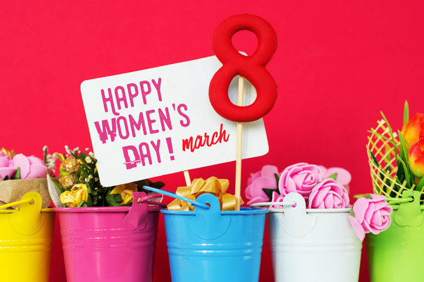 lollipop shape figure eight 8, note for text, flowers in colored buckets. Happy International Womens Day celebrate on March 8, congratulatory CARD. - Фото, изображение
