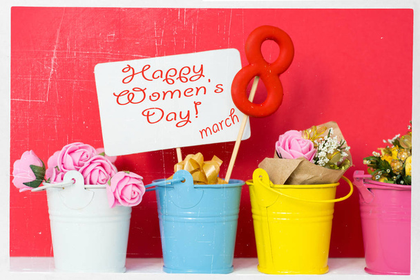 lollipop shape figure eight 8, note for text, flowers in colored buckets. Happy International Womens Day celebrate on March 8, congratulatory CARD. - 写真・画像