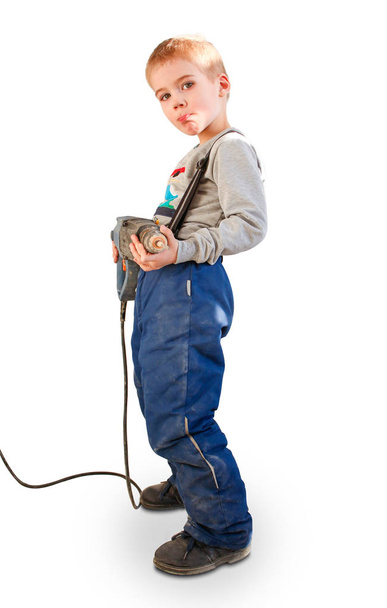 Boy child with the building tool. Isolated on white background.  - Valokuva, kuva