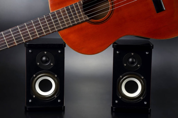 two stereo audio speakers, and classical acoustic guitar - Photo, Image
