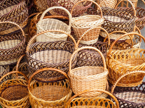 Wicker is a material made of plant stalks, branches or shoots formed by a kind of weaving into a rigid material, basket, pannier, car, chip basket, corf, nacelle - Photo, Image