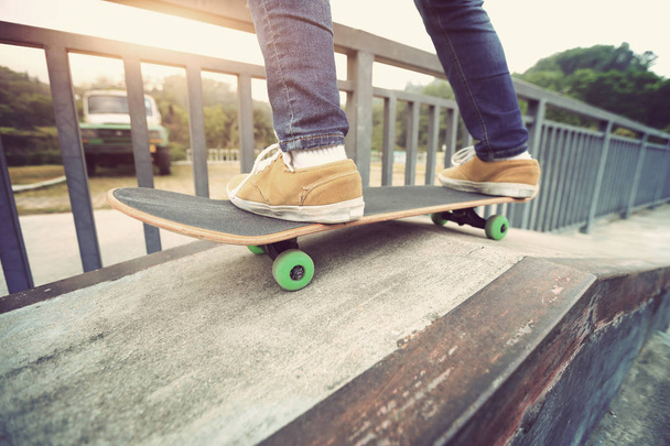 skateboarder legs riding skateboard  - 写真・画像