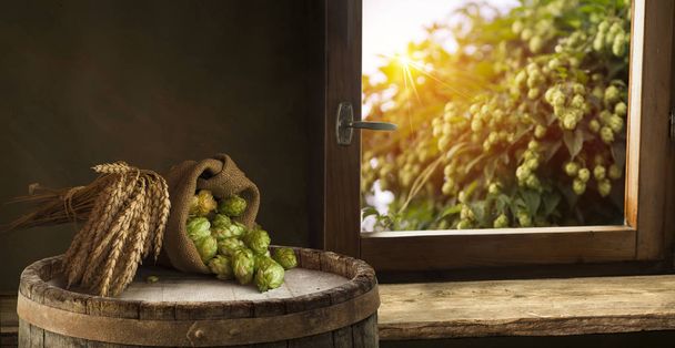 Beer barrel with beer glasses on table on wooden background - Fotoğraf, Görsel