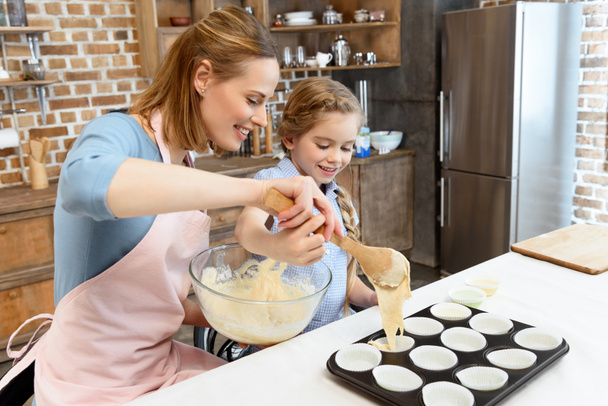 Mother and daughter baking cookies - Photo, Image