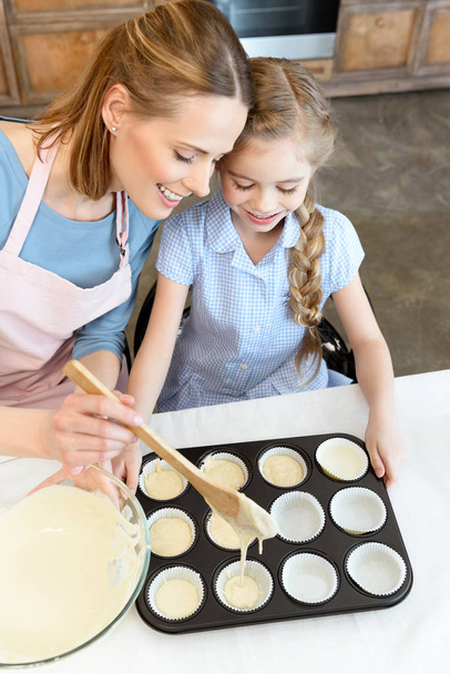 Mother and daughter baking cookies - Photo, Image