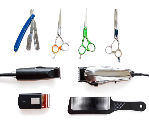 Barber shop equipment tools on white background. Professional hairdressing tools. Comb, scissor, clippers and hair trimmer isolated.  - Photo, Image