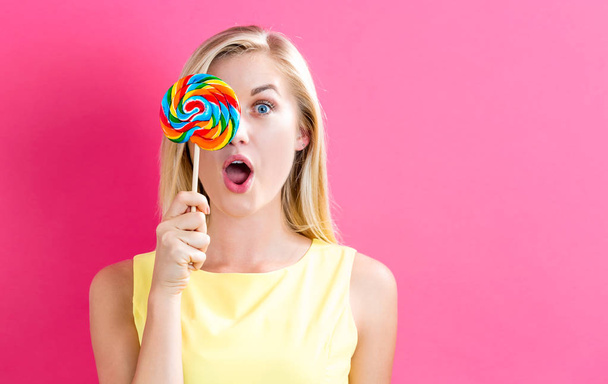 Woman holding lollipop - Zdjęcie, obraz