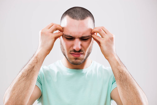 Man having headache - 写真・画像