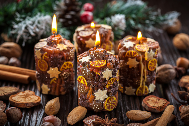 Rustic Christmas candles with spices and nuts - Zdjęcie, obraz