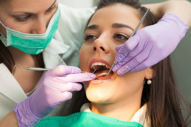 Patient and dentist in the dental practice - Photo, image