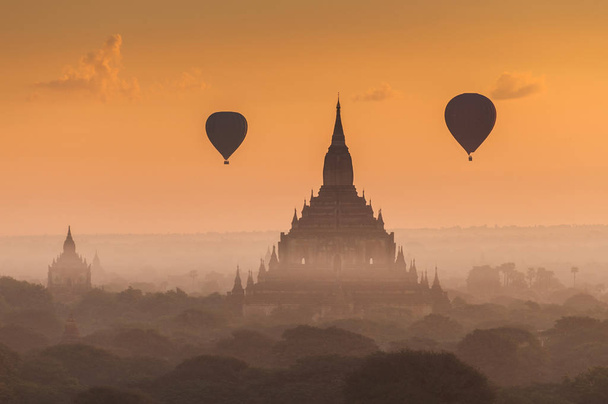 Hot air balloon over plain of Bagan in misty morning, Myanmar. - Photo, Image