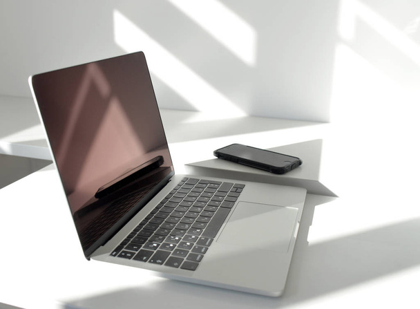 laptop computer, shadow, sunlight - Φωτογραφία, εικόνα