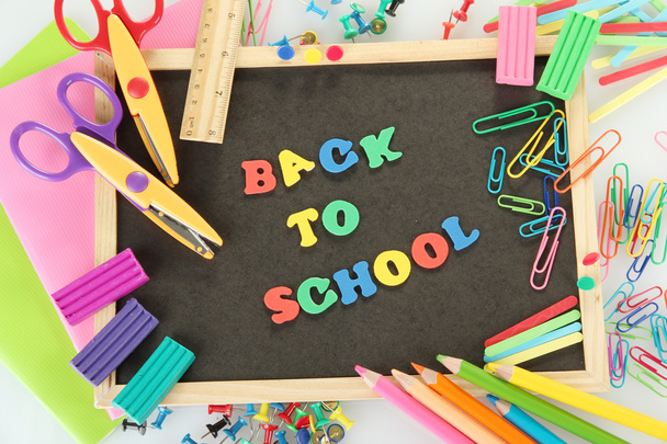 Small chalkboard with school supplies on white background. Back to School - Zdjęcie, obraz