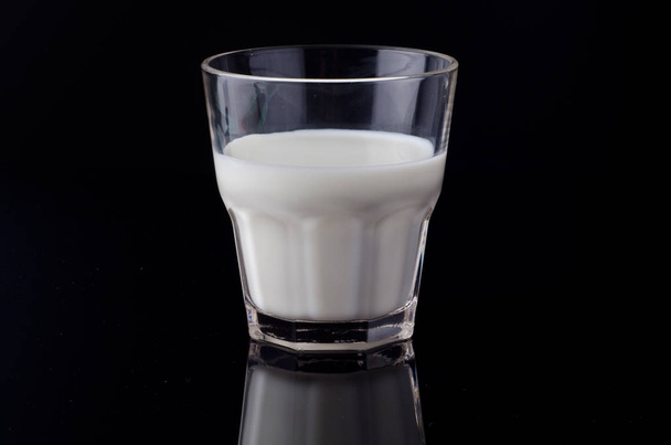 Milk on the black background - Fotoğraf, Görsel
