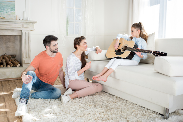 Happy family with guitar - Foto, immagini