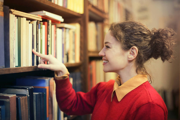 Woman pointing a book - Photo, image