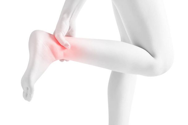 Acute pain in a woman  ankle isolated on white background. Clipping path on white background. - Photo, Image
