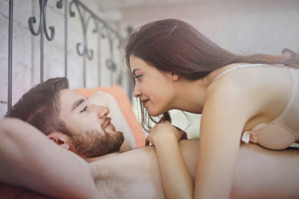 Couple in love in bed - Photo, image