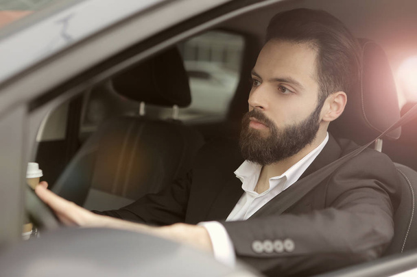 Businessman in car - Фото, изображение
