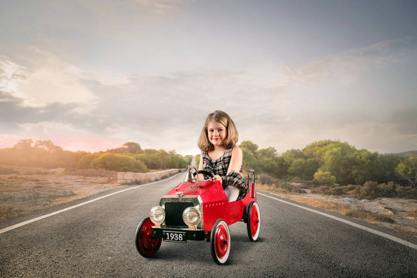 Girl in little car - Фото, зображення