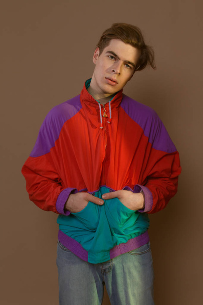 Cute guy in hipster clothes 90s posing in studio - Foto, Imagen