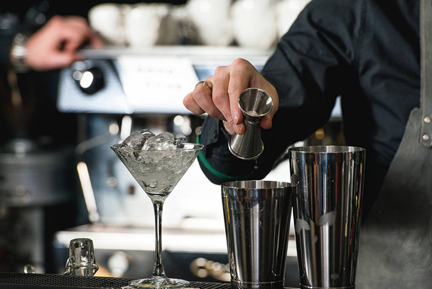 bartender making relaxing coctail on a bar background - Photo, Image