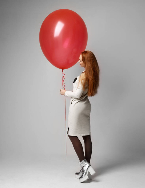 Young happy girl with big huge red balloon as a present for birt - Фото, зображення