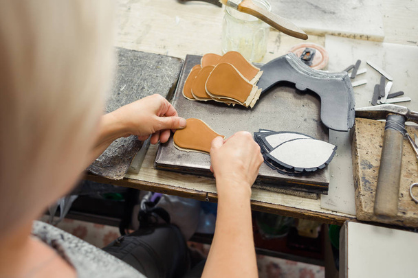 Shoemaking is the process of making footwear. - Foto, Imagem