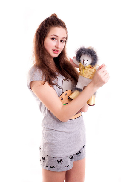 Amazing girl play with bear toy isolated - Фото, изображение