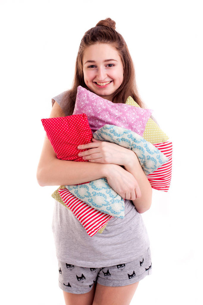 Pillow fight, pretty girl hold colour pillows - Foto, imagen